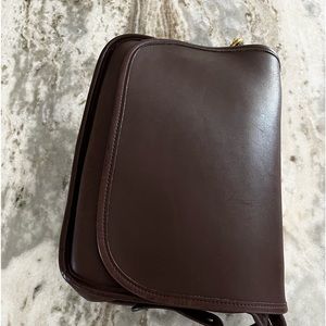 Coach vintage (early 2000’s) brown leather classic shoulder saddle bag.